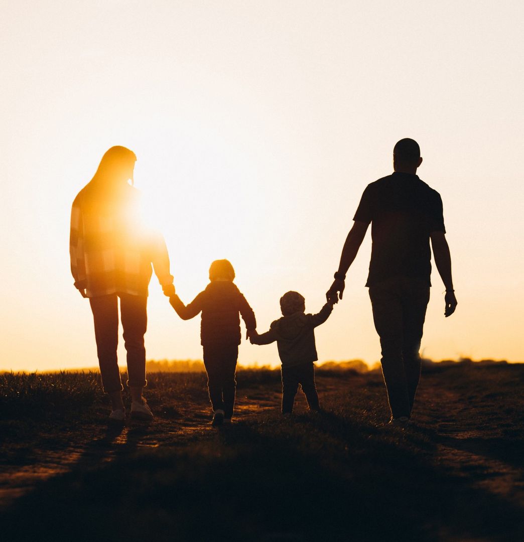 Family walking in hte sunset