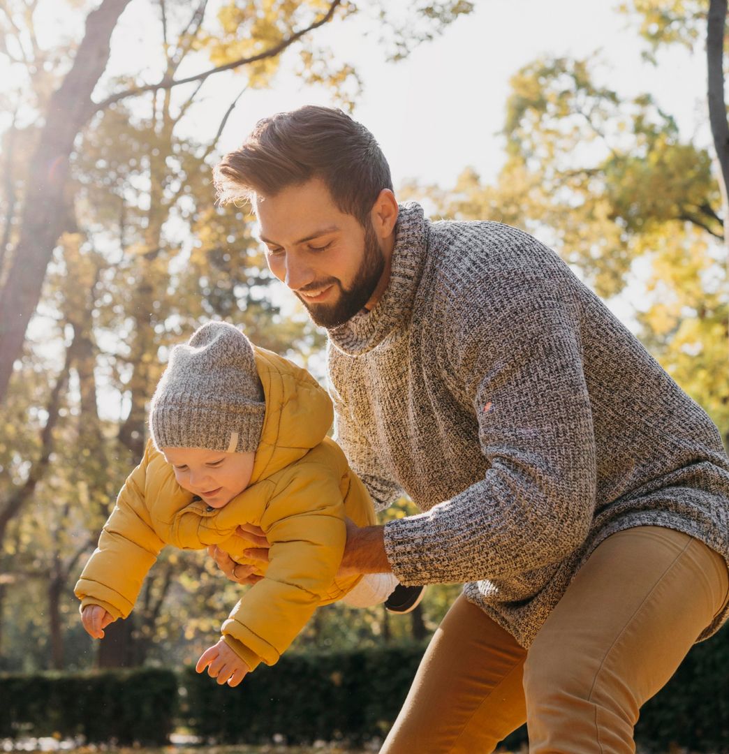 Father holding child and playing